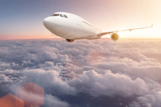 istock Commercial airplane flying above clouds 902926144