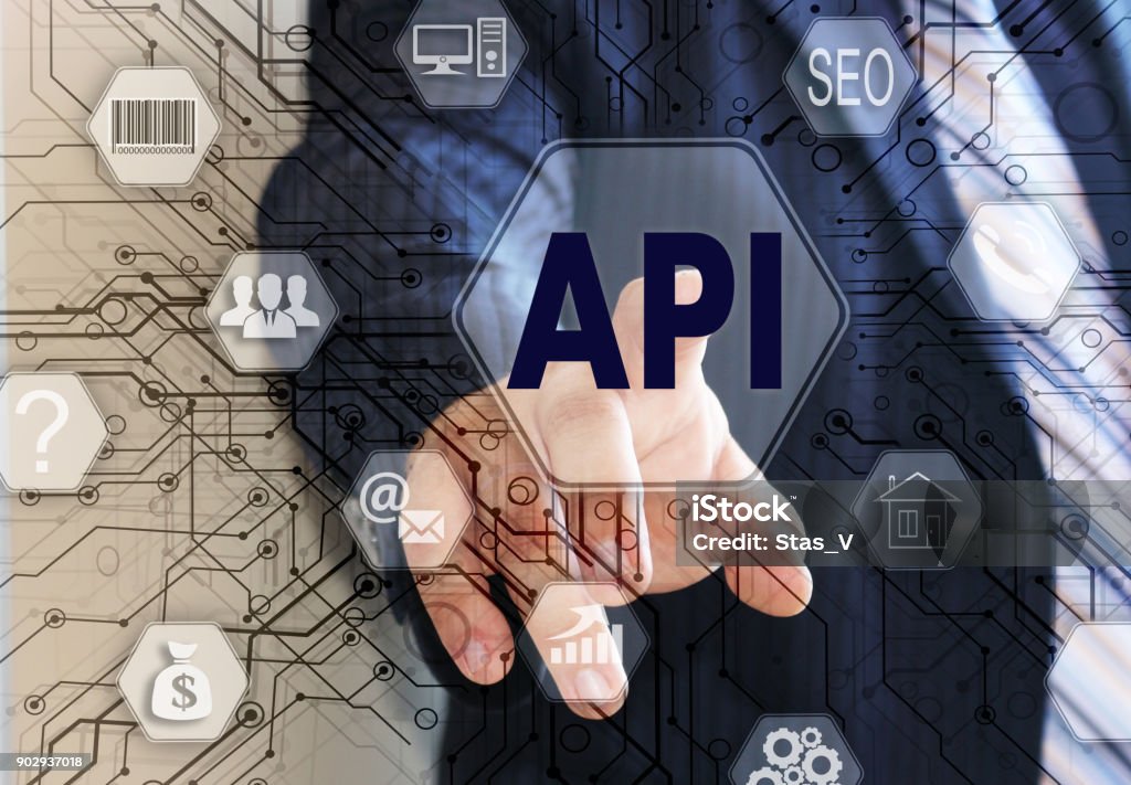 The businessman chooses the API, Application Programming Interface on a touch screen. Concept API Adult Stock Photo