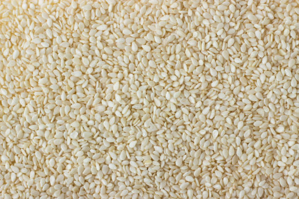 istock sesame seed spice as a background, natural seasoning texture 902939240