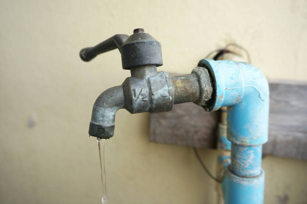 close up of chrome faucet and water pipeline - graphite imagens e fotografias de stock