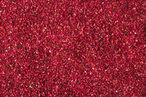 istock Dried sumac spice as a background, natural seasoning texture 902944316