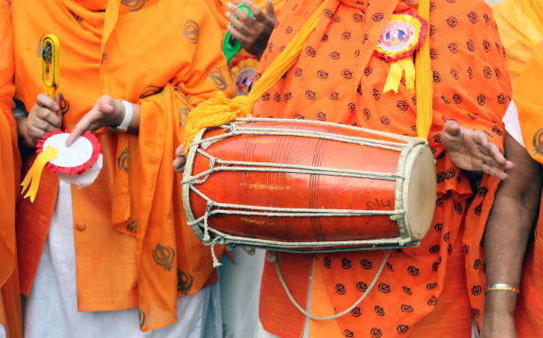 Indian Sikh women sing holy hymns in Nagar Keertan, lead float with holy scripture,in procession a custom stock photo