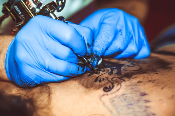 istock master tattoo woman on her back 902952172