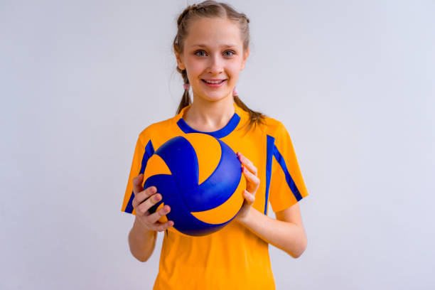 istock Girl playing volleyball 902957358