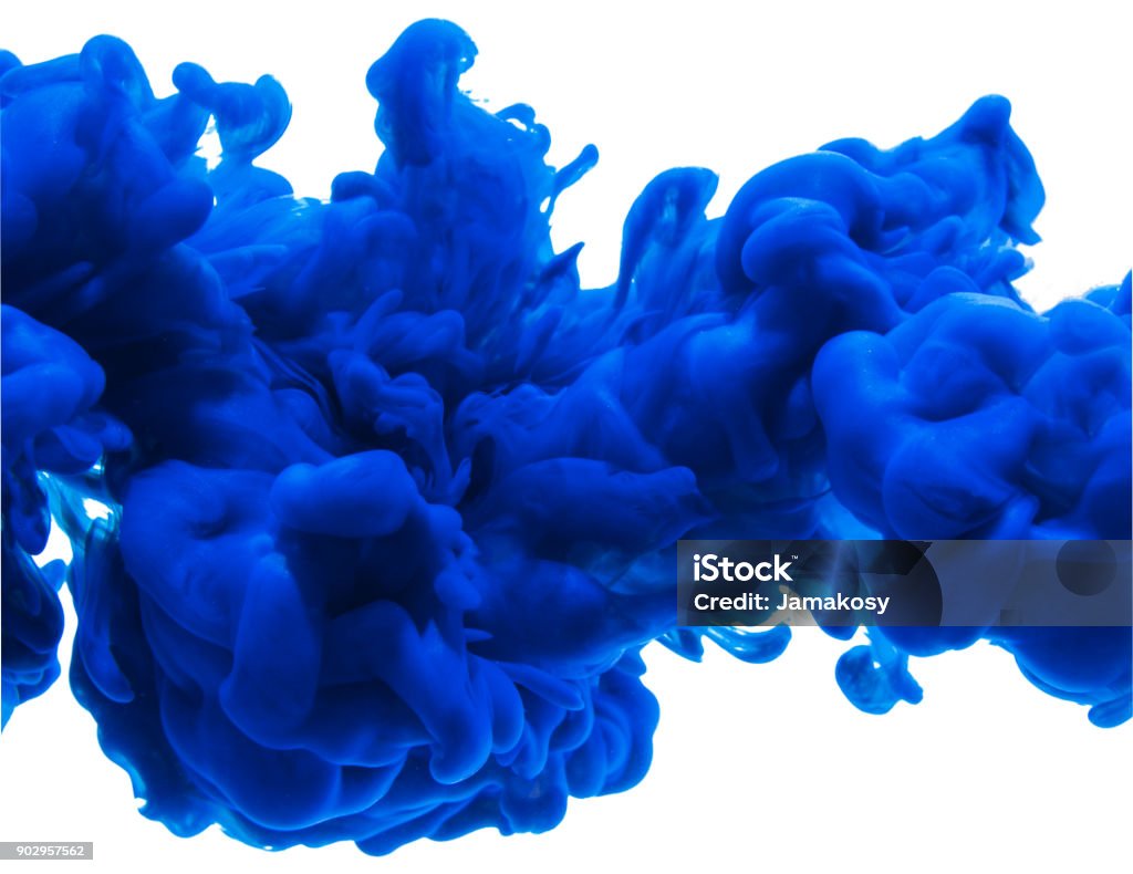 Ink blue color paint pouring in water isolated on white background Abstract Ink blue color paint pouring in water Blue Stock Photo