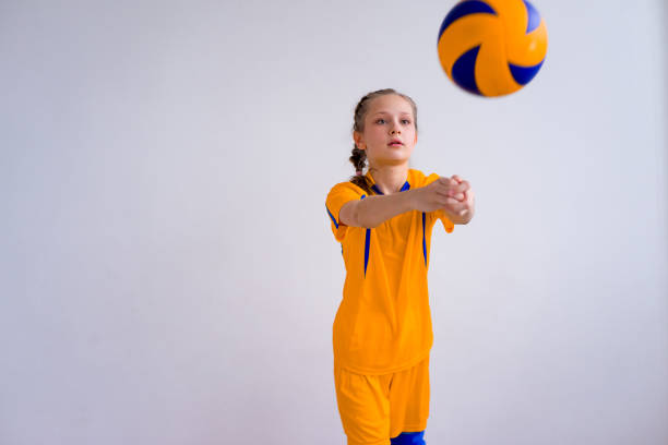 Girl playing volleyball A portrait of a teen girl playing volleyball young volleyball girl stock pictures, royalty-free photos & images