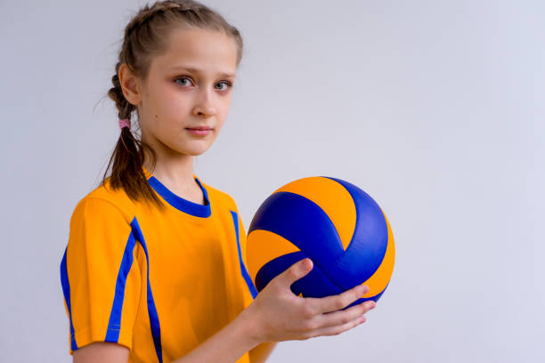 istock Girl playing volleyball 902957860