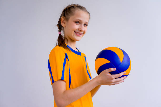 istock Girl playing volleyball 902958004