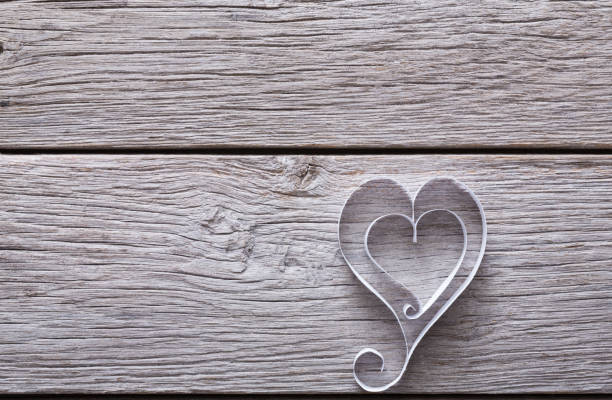 istock Valentine background with handmade paper heart on blue rustic wood 902958348