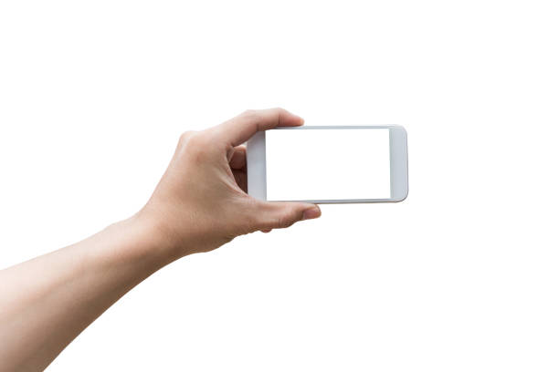 istock Man hand holding white smart phone with white blank screen. smart phone on selfie isolated on white with clipping path 902960664