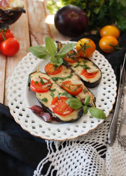 istock Baked eggplants stuffed with vegetable and cheese 902962072