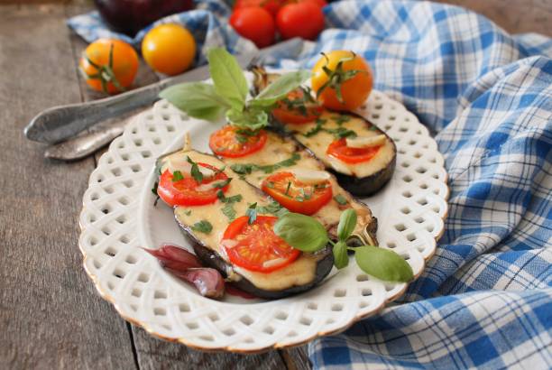 istock Baked eggplants stuffed with vegetable and cheese 902962094