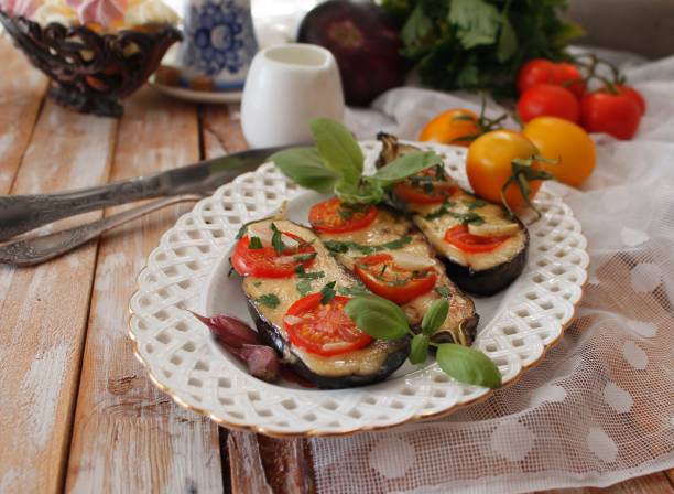 istock Baked eggplants stuffed with vegetable and cheese 902962158