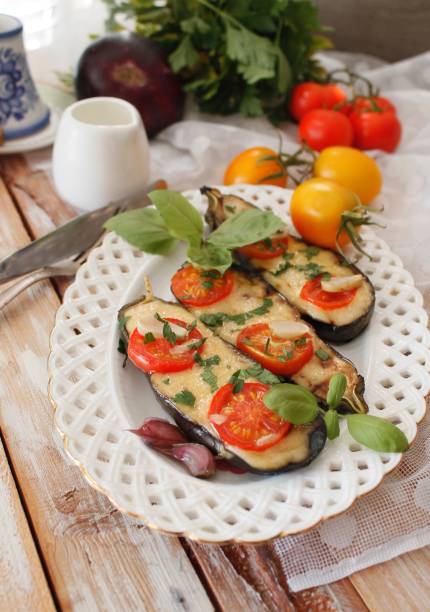 istock Baked eggplants stuffed with vegetable and cheese 902962170