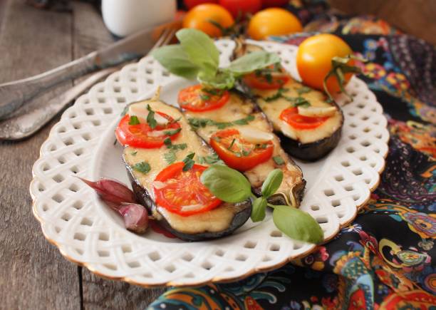 istock Baked eggplants stuffed with vegetable and cheese 902962202