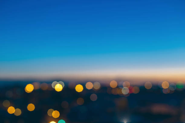 istock Abstract blurred bokeh lights over city night view 902970152