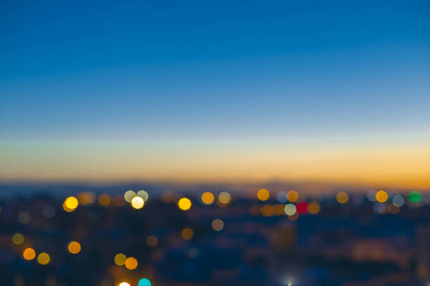 istock Twilight blurred bokeh lights city downtown, abstract background. 902970164