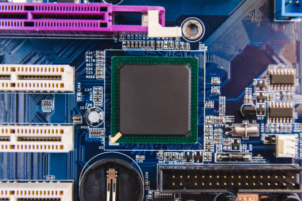 istock close up chip and Electronic hardware on motherboard top view 902973132