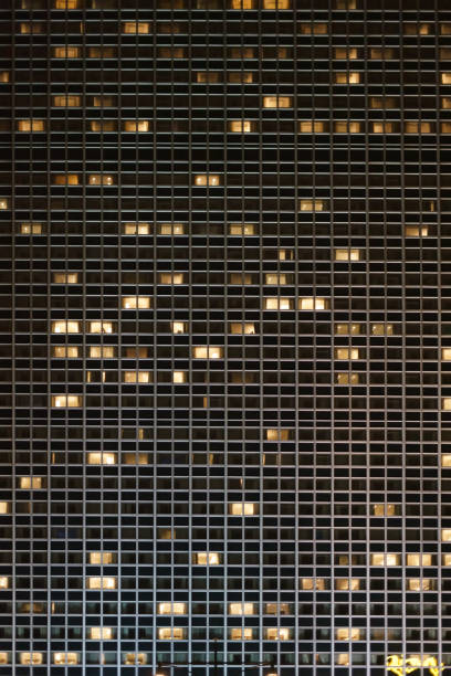istock High-rise windows in the night 902973546