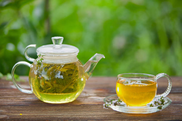 istock delicious green tea in a beautiful glass bowl on  table 902973730