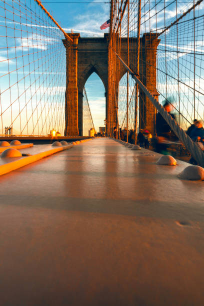 istock Motion Blur of People Walking on Brooklyn Bridge 902973794