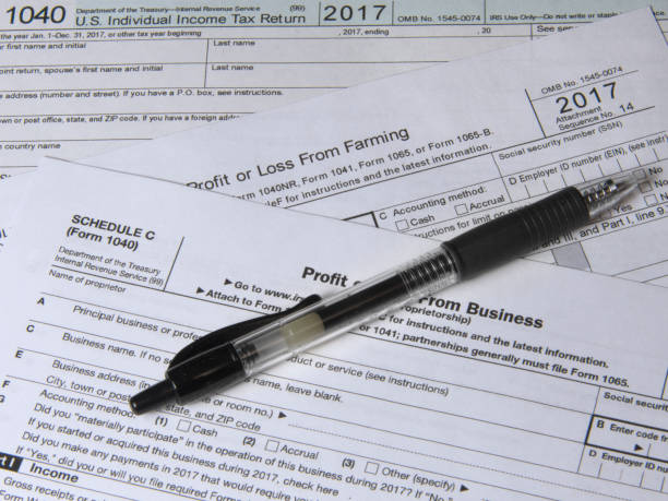 istock 2017 I.R.S. tax forms & a pen 902974300