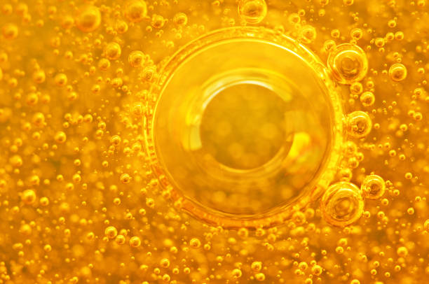 istock Golden background with big and small gold bubbles oil inside a gold liquid. 902974702