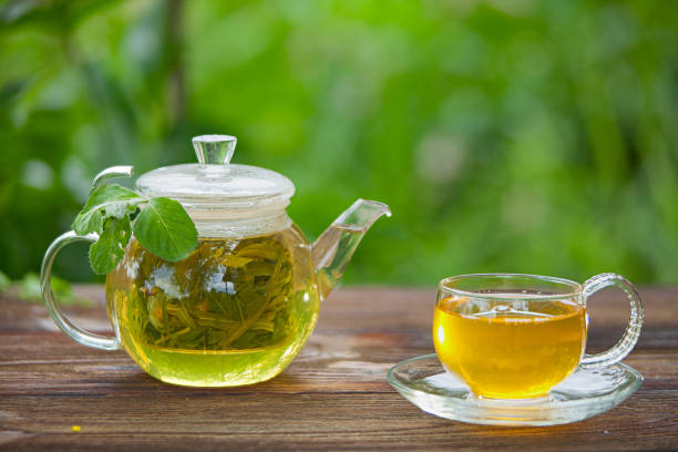 istock delicious green tea in a beautiful glass bowl on table 902974732