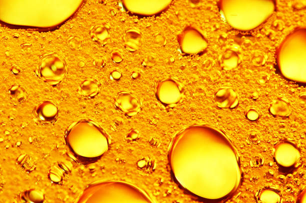 istock Golden background with big and small gold bubbles oil inside a gold liquid. 902976102