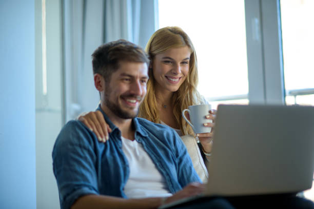 istock Young couple at home 902978948