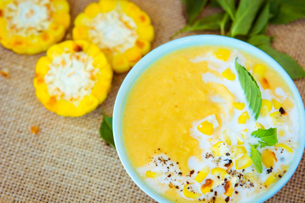 istock Vegetarian corn cream soup in the bowl on the rustic table 902986624