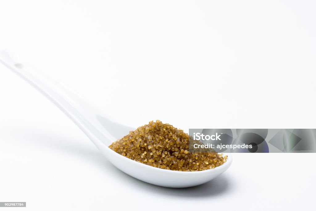 brown cane sugar Sugar extracted from unrefined sugar cane, for that reason it retains that brown color. It's becoming fashionable as healthier versus refined white sugar. Brown Stock Photo
