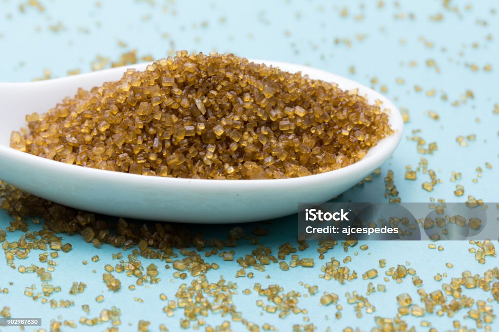 brown cane sugar Sugar extracted from unrefined sugar cane, for that reason it retains that brown color. It's becoming fashionable as healthier versus refined white sugar. Brown Stock Photo