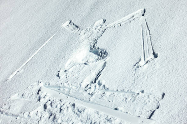 A skier snow angel on freshly fallen snow.