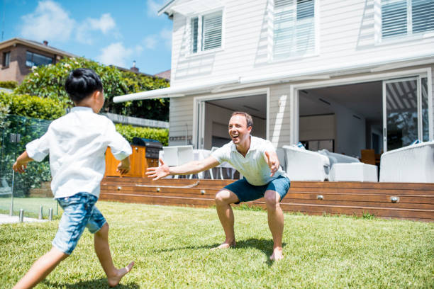istock Father and son playing outdoors 902990860