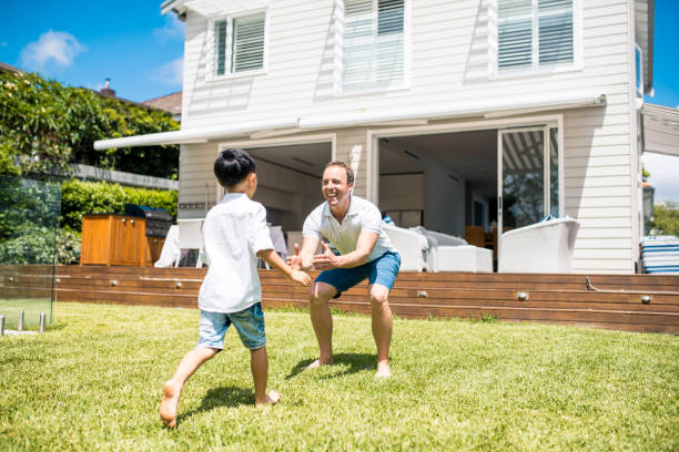 istock Father and son playing outdoors 902990874