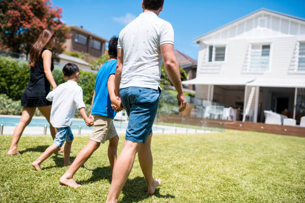 istock Family walking and holding hands 902990956