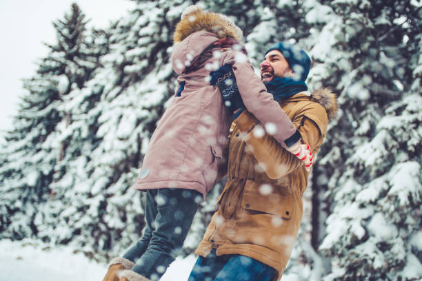 istock Dad with daughter outdoor in winter 902991012