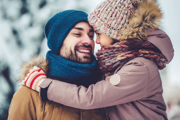 istock Dad with daughter outdoor in winter 902991080