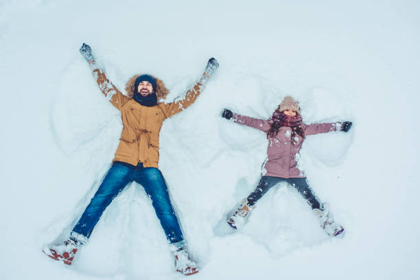 istock Dad with daughter outdoor in winter 902991468