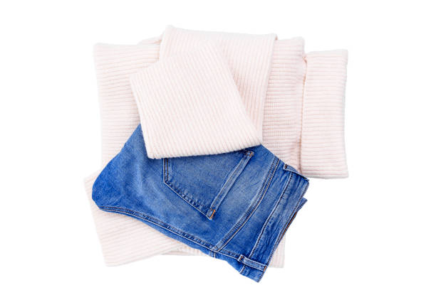 istock Jeans and warm sweater on a white background. 902994080