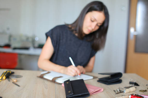 istock Sales manager making list of produced b 902995876