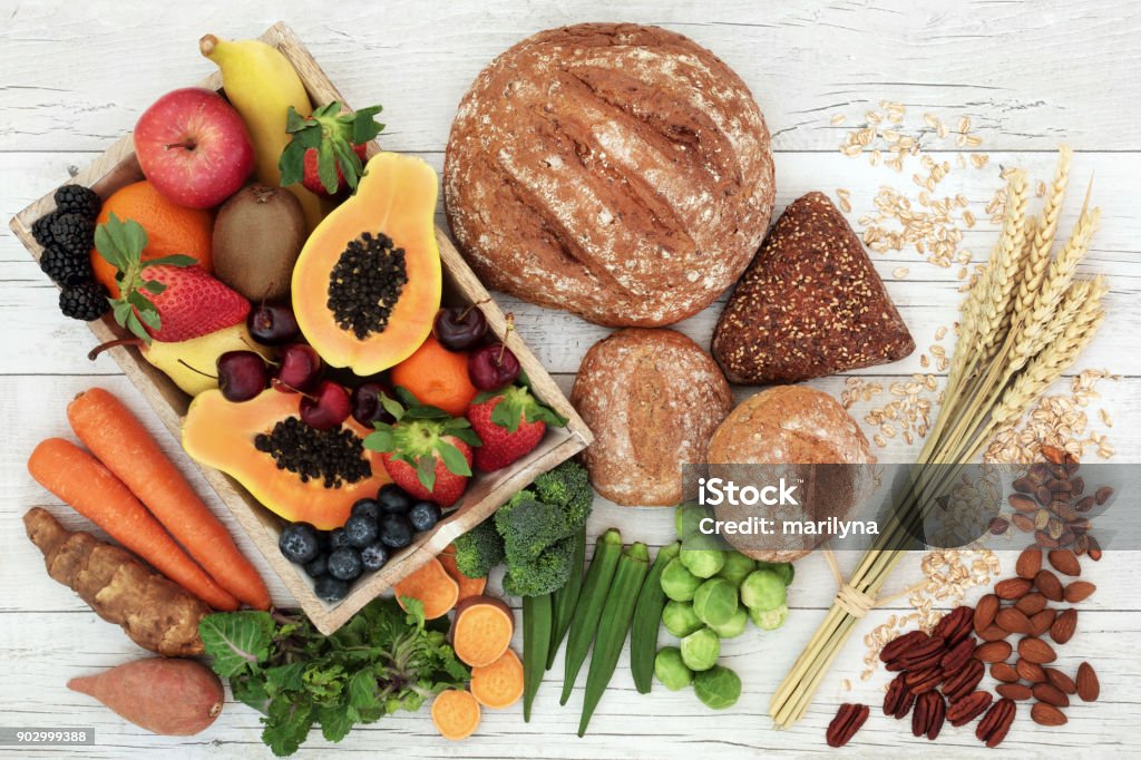 High Fiber Health Food High fiber health food concept with fresh fruit, vegetables, wholegrain bread, nuts and cereals. Foods high in antioxidants, anthocyanins, omega 3 fatty acids and vitamins. Rustic background, top view. Carbohydrate - Food Type Stock Photo