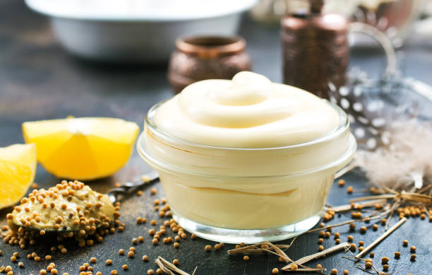 mayonnaise mayonnaise in glass bowl and on a table mustard fruits stock pictures, royalty-free photos & images