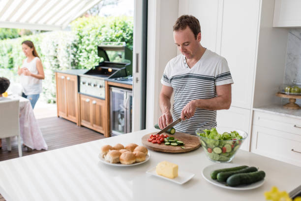 istock Father preparing food for barbecue 903002832