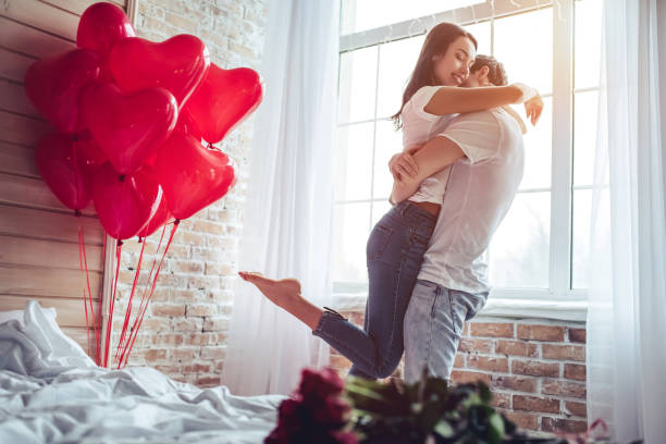 couple in bedroom. - valentines day red photography indoors imagens e fotografias de stock