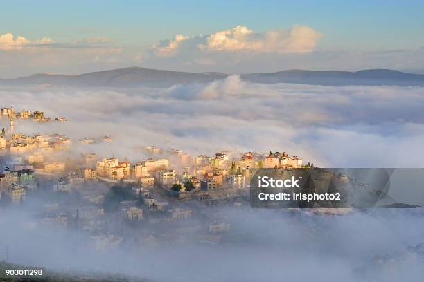 Biblical Village Cana Of Galilee In Morning Fog Nazareth In Israel Stock Photo - Download Image Now