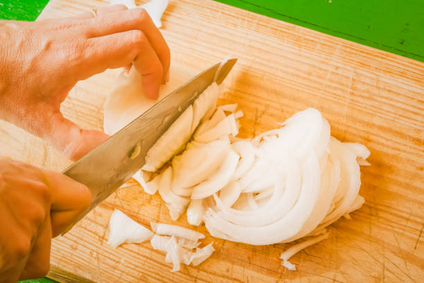 istock Girl cutting fresh onions 903016036