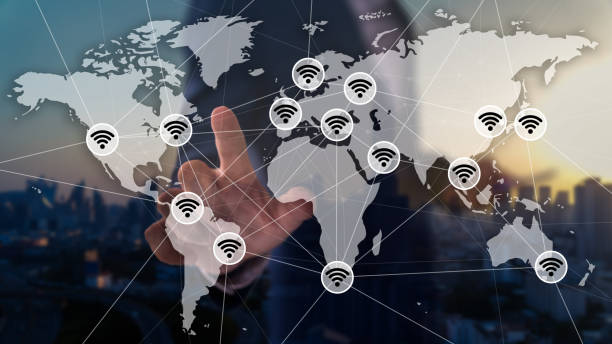 Double exposure of business man with wifi icons, worldmap and city scape background. Internet corporate communication. stock photo