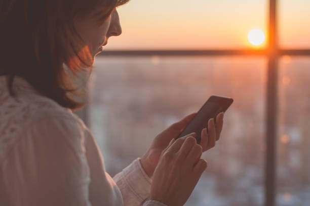 istock female hands holding smartphone, typing, using touchscreen and wi-fi internet 903019164